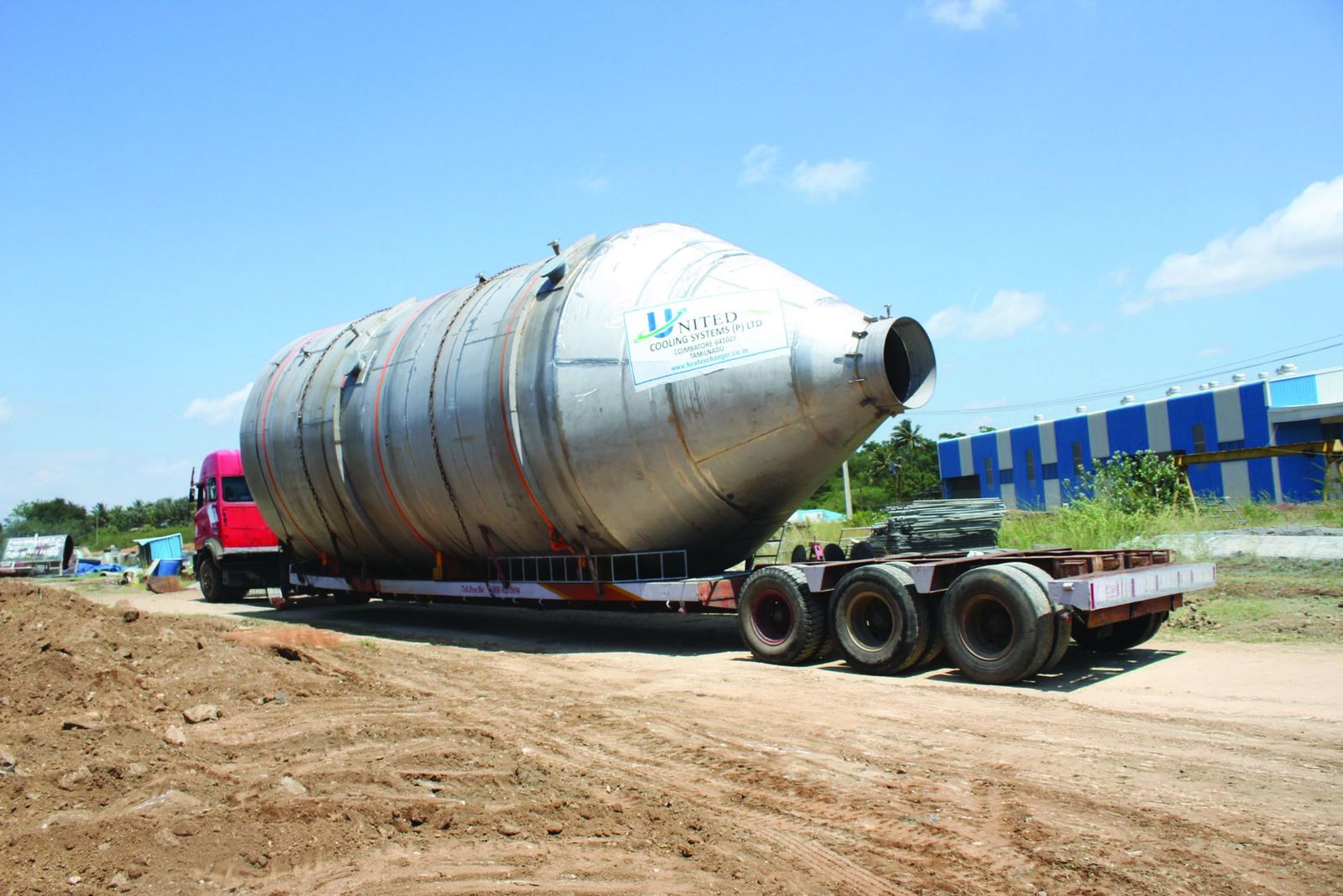 Oversized vessel on a trailer heading for the port